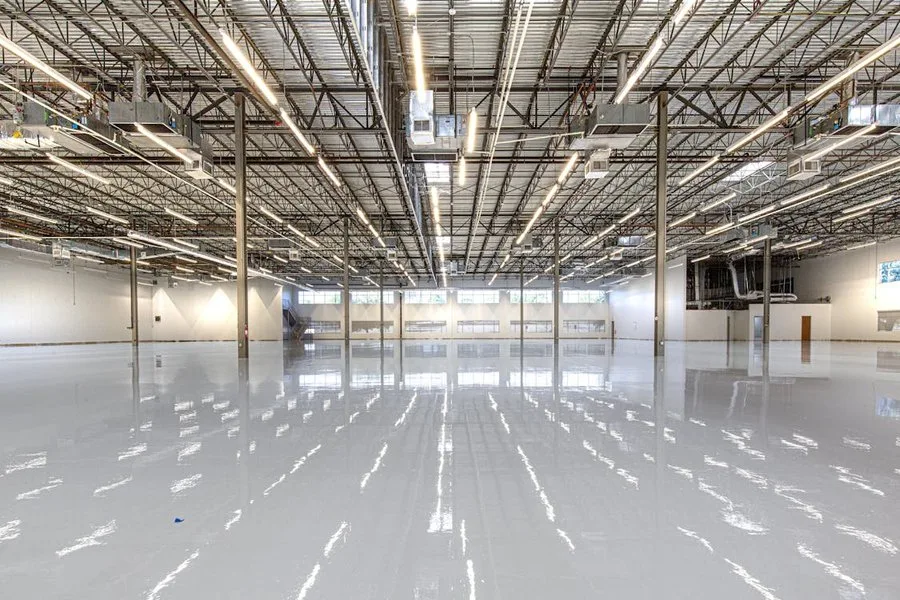 Large warehouse with high-gloss epoxy floor — industrial flooring